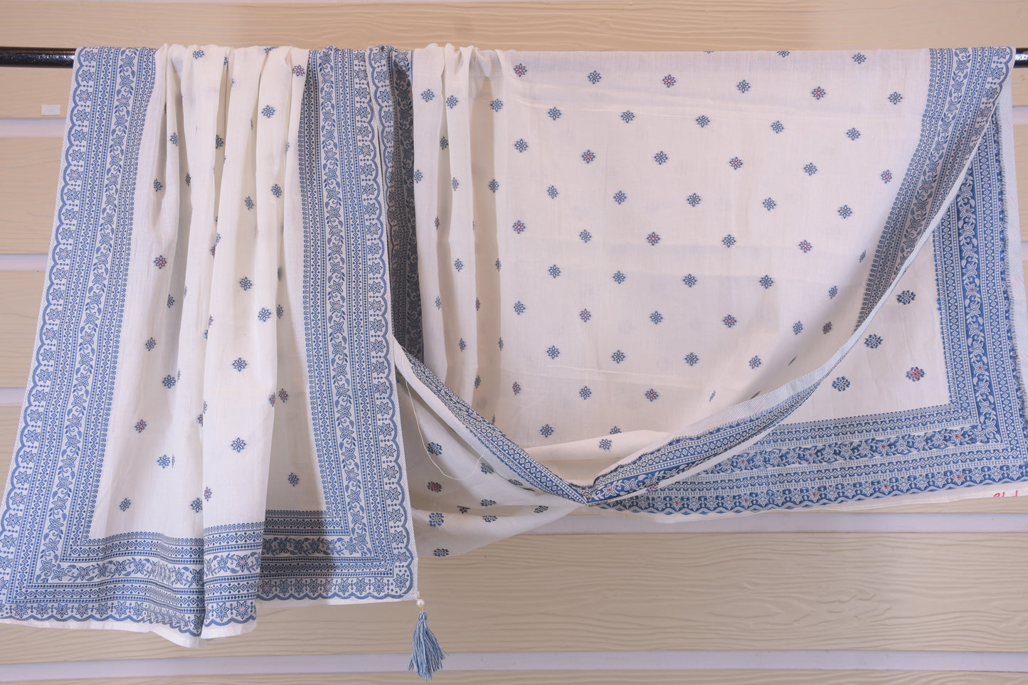 Porcelain Blooms: White Dress Material with Blue Yoke Detail