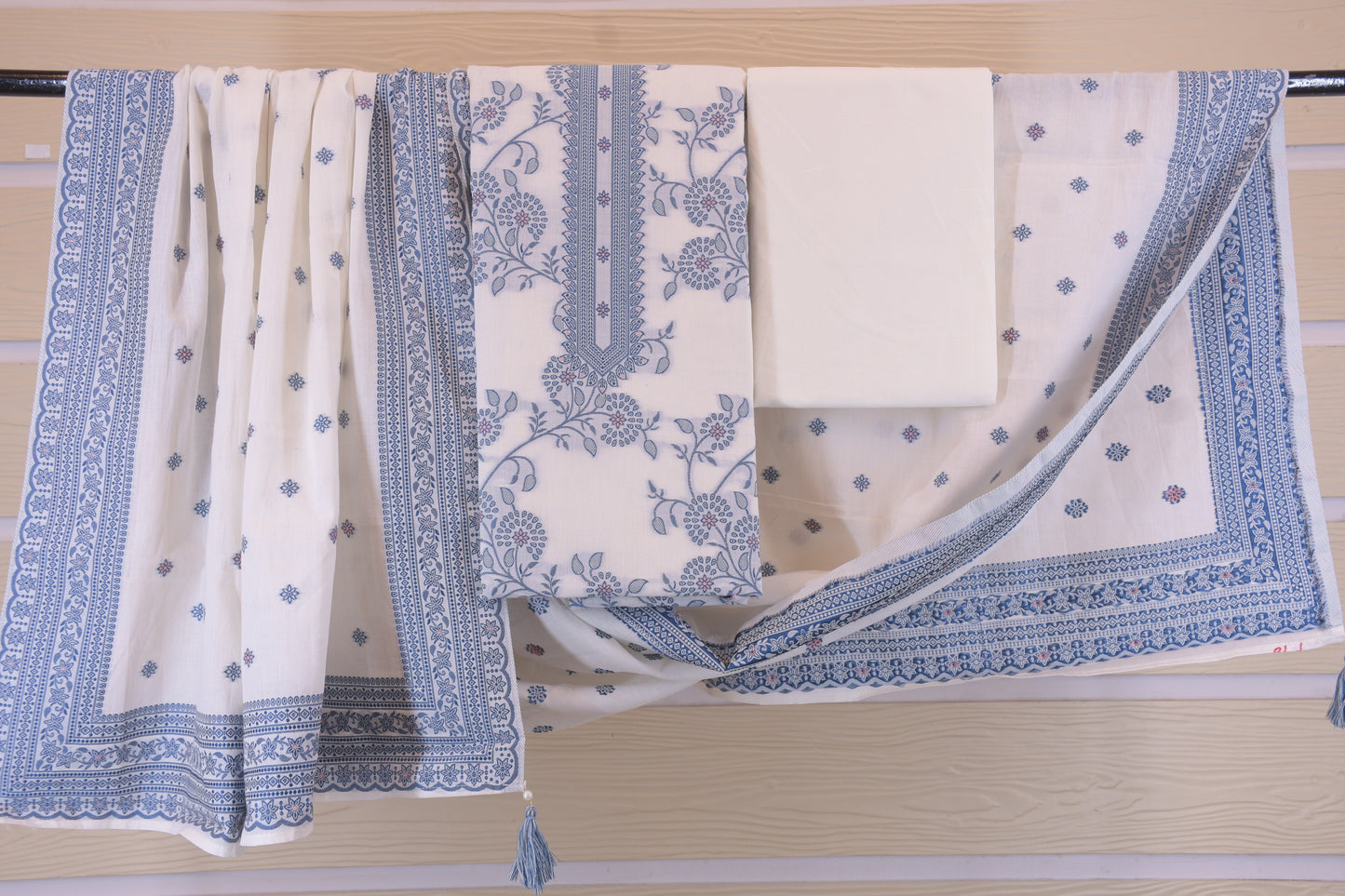 Porcelain Blooms: White Dress Material with Blue Yoke Detail