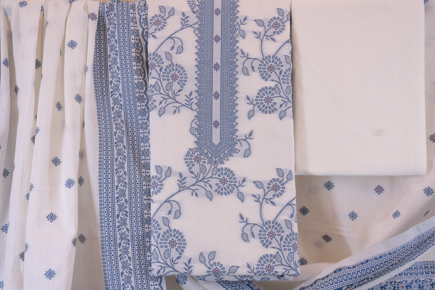 Porcelain Blooms: White Dress Material with Blue Yoke Detail