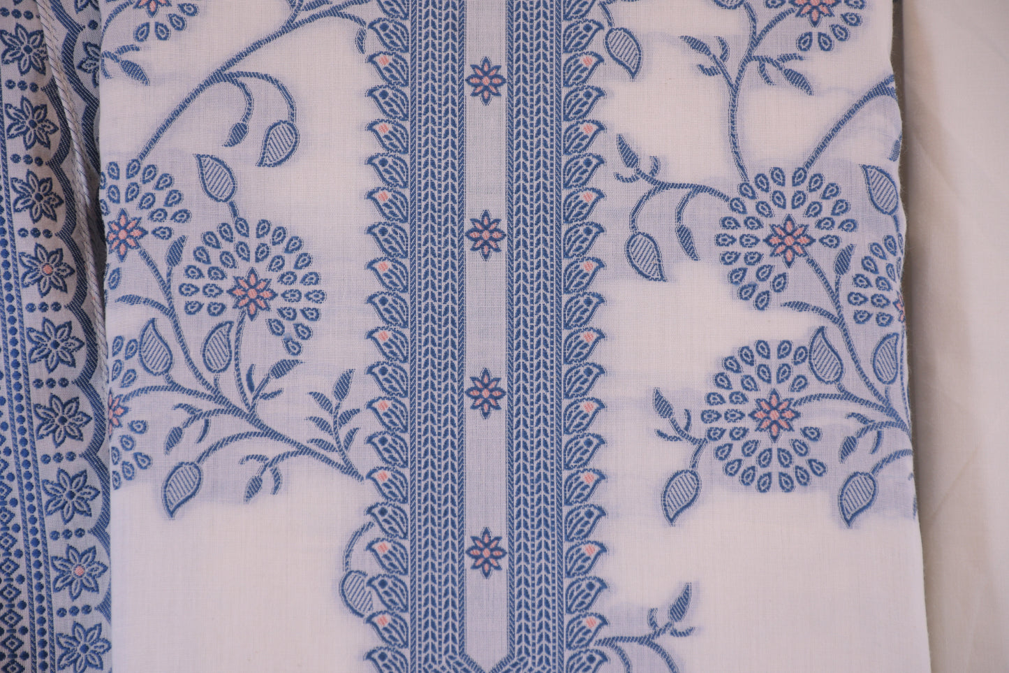 Porcelain Blooms: White Dress Material with Blue Yoke Detail