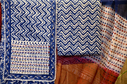 Blue & white cotton dress material with dabu print.