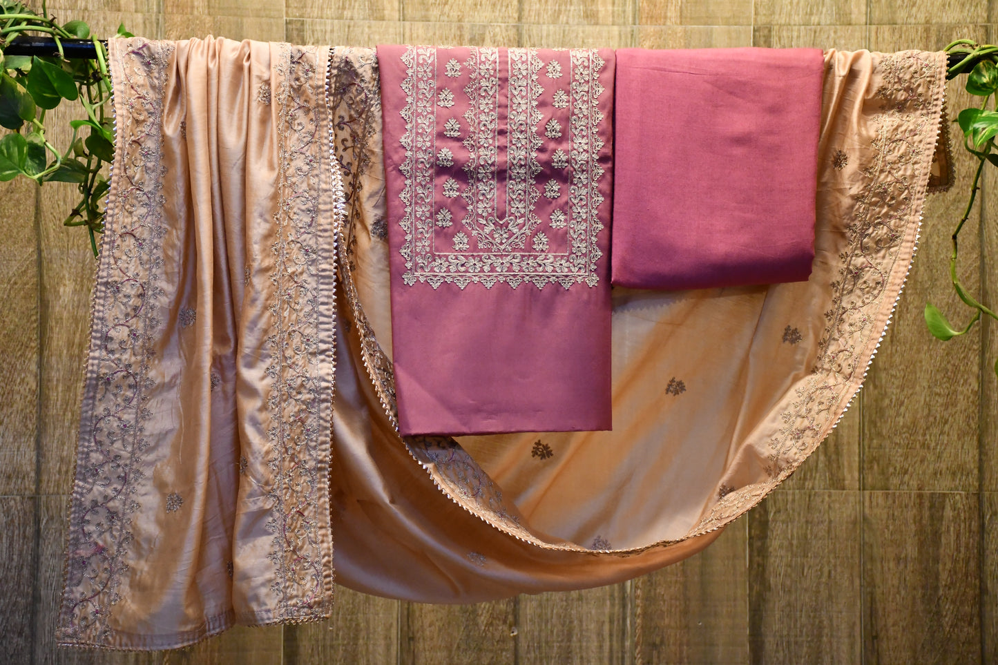 Pink silk dress material with zari embroidery work.
