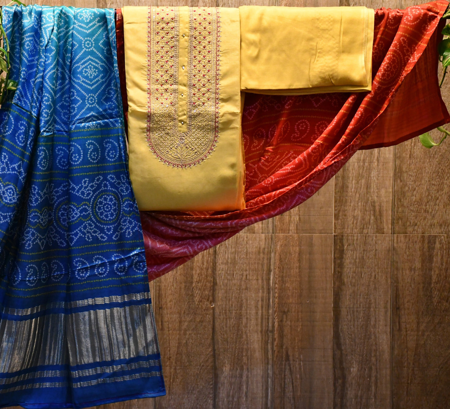 Yellow silk dress material with bandhej dupatta.