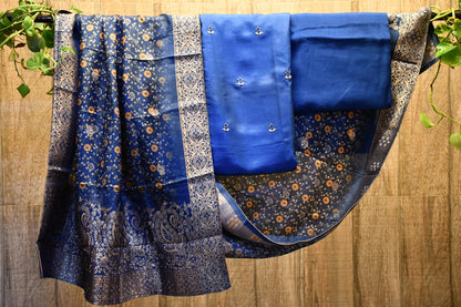 Blue silk dress material with brocade dupatta.