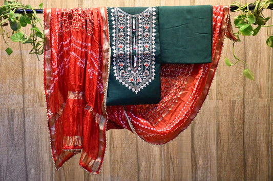 Red & green silk dress material with bandhej dupatta.