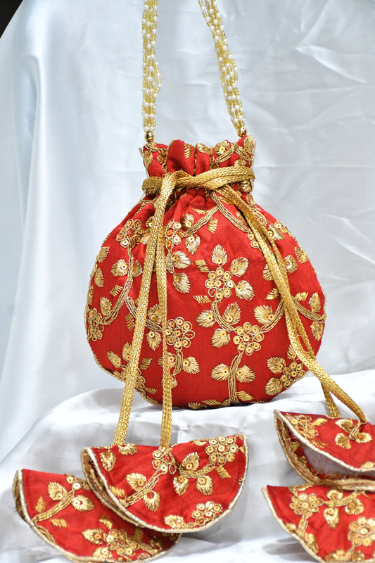 Red potli bag with golden zari work