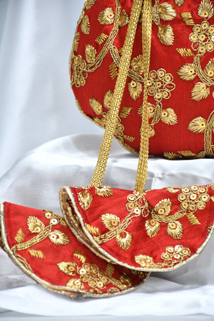Red potli bag with golden zari work