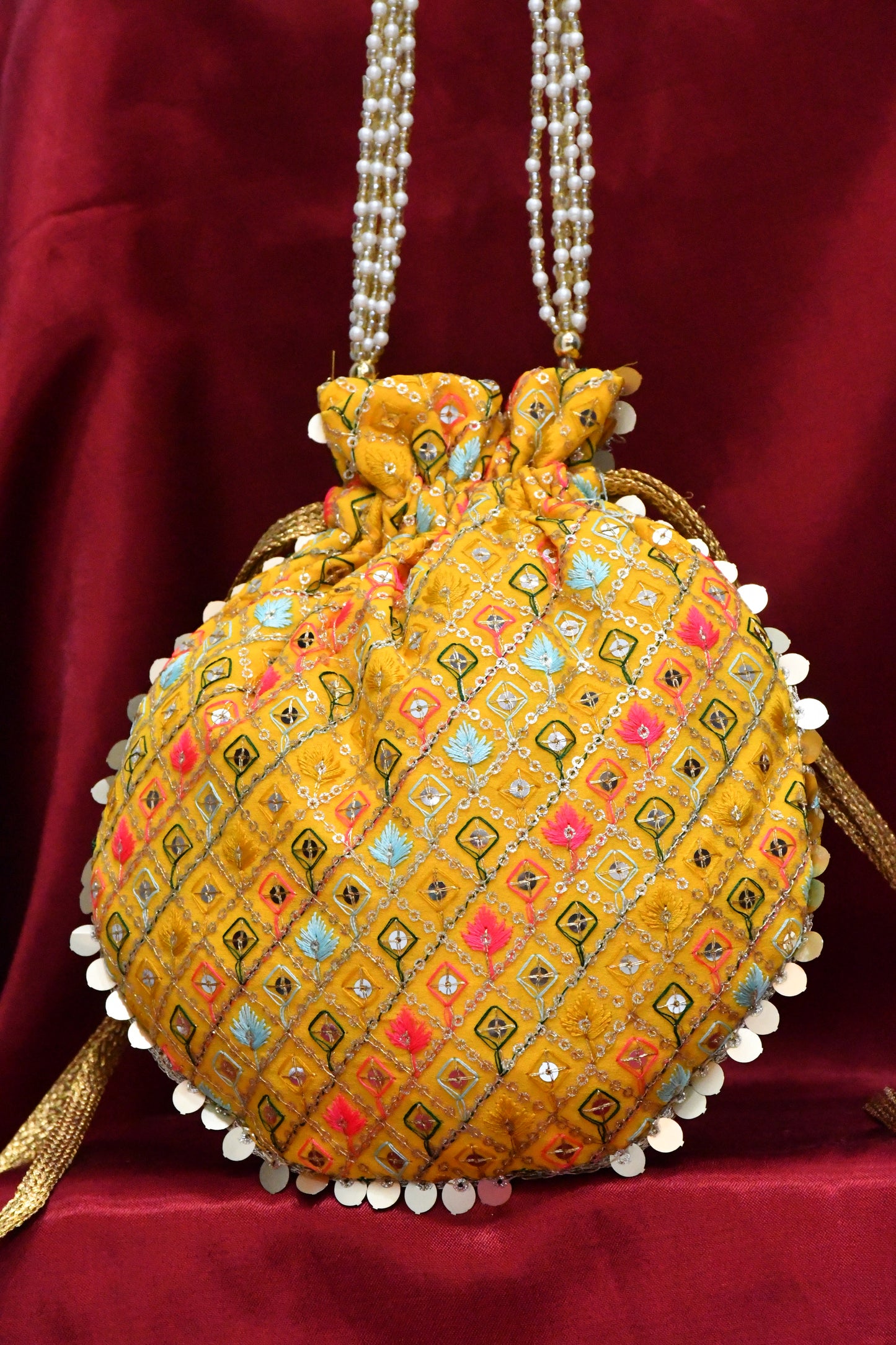 Yellow potli with multicolor embroidery