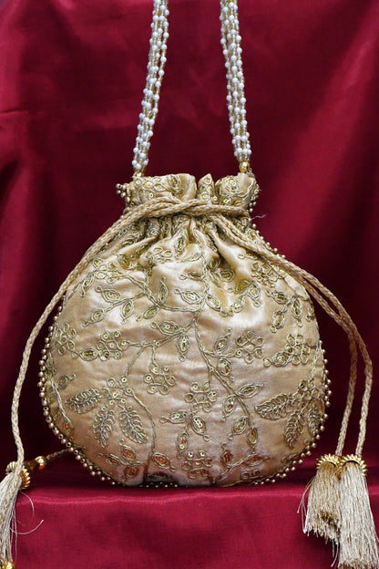 Golden round potli bag with golden zari work