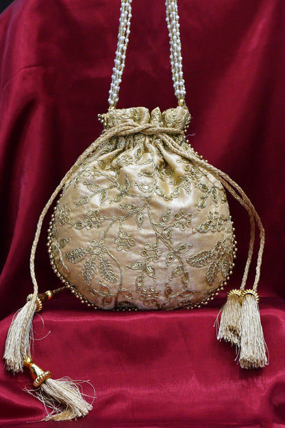 Golden round potli bag with golden zari work