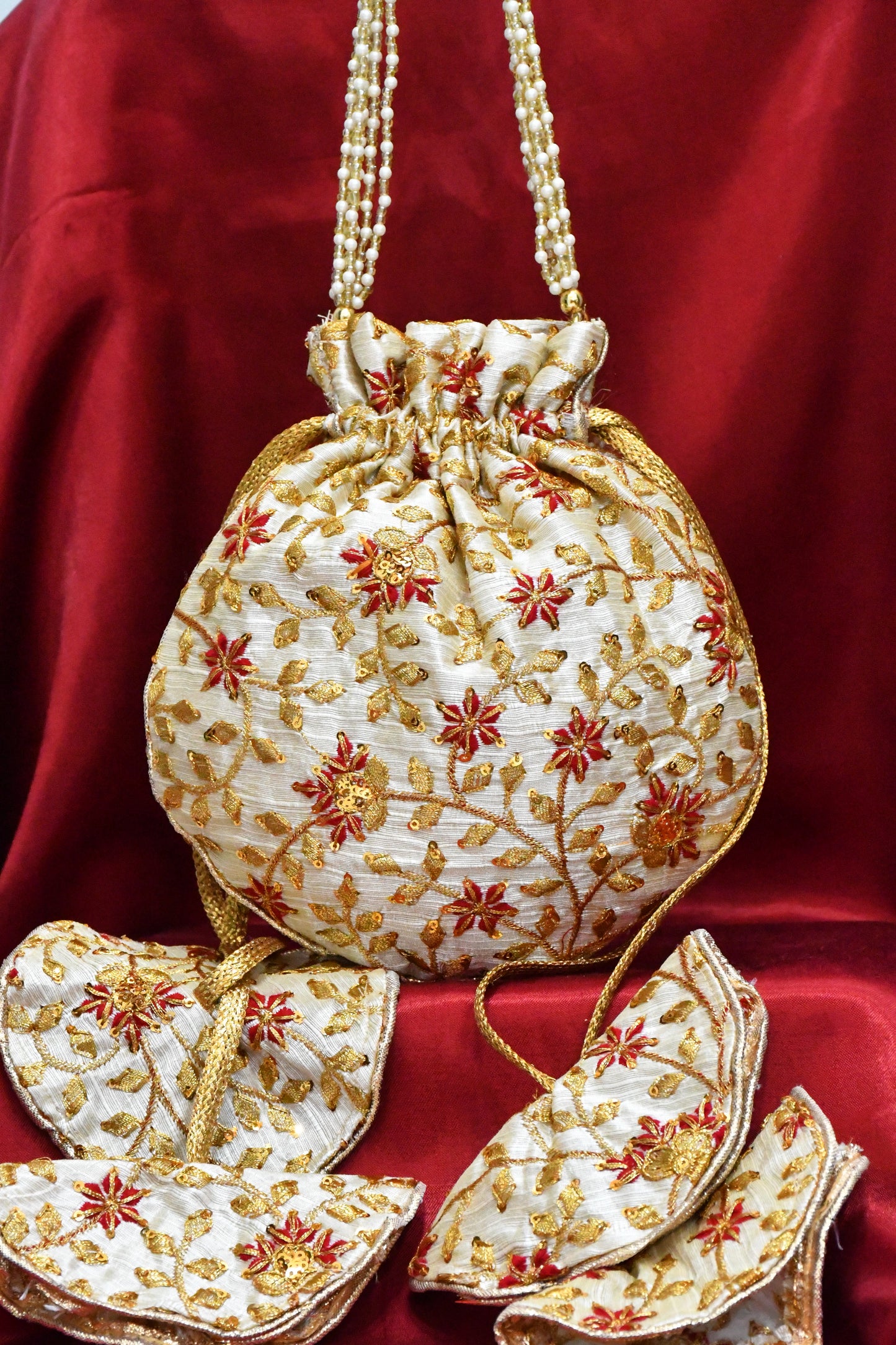 Round potli bag with floral embroided work