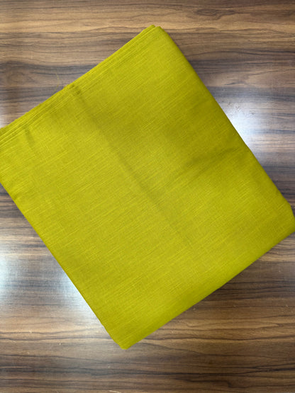 Green fabric on a wooden surface