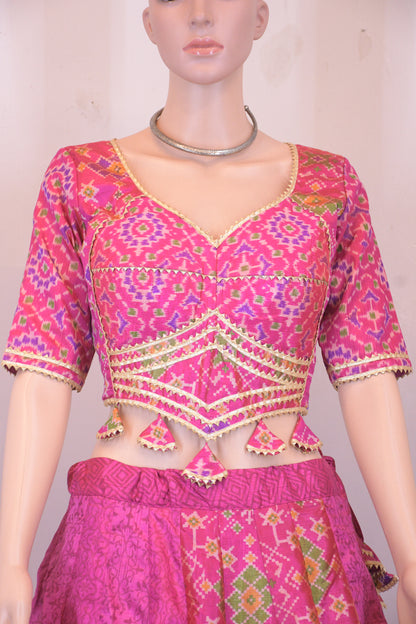 Magenta Silk Patola Chanya Choli with Intricate Border Detailing | Siddhi Boutique