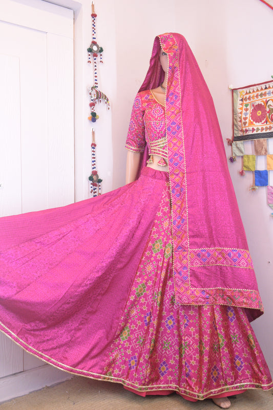 Magenta Silk Patola Chanya Choli with Intricate Border Detailing | Siddhi Boutique